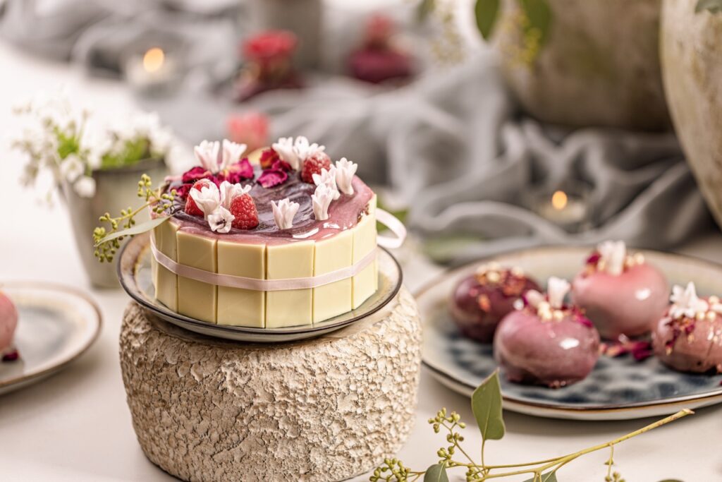Still life of fancy dessert table, little circle cake and mousse cake